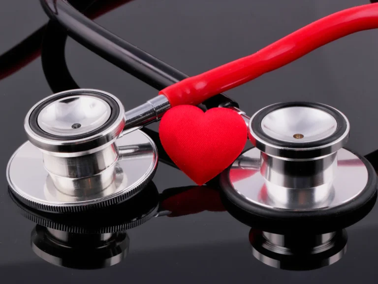 A stethoscope and a heart on a table