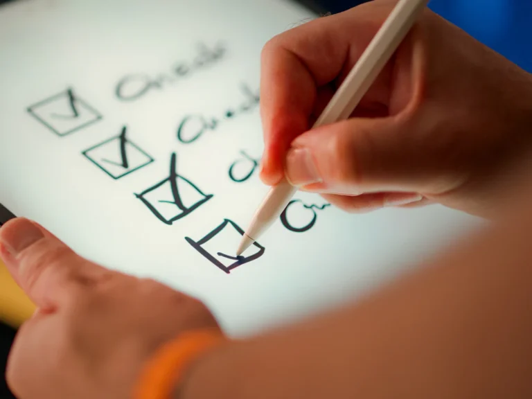 A hand marks off items on a checklist