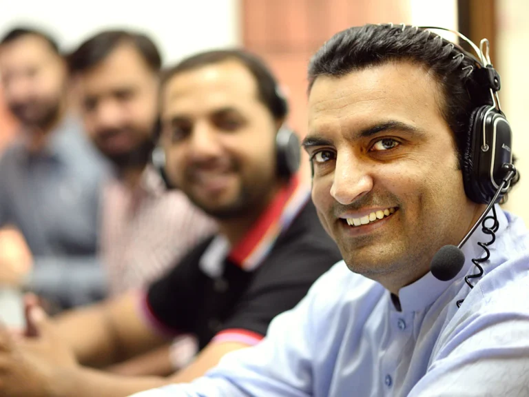 Man in white button up shirt smiling