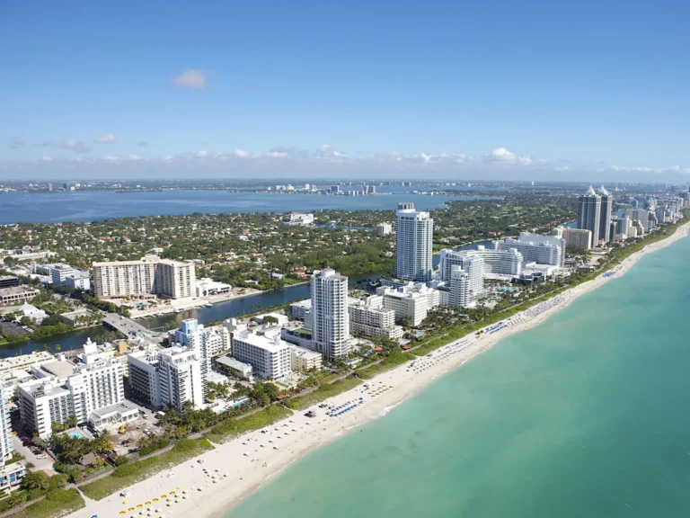An aerial view of the coastline and high-rise buildings in Miami Beach, Florida