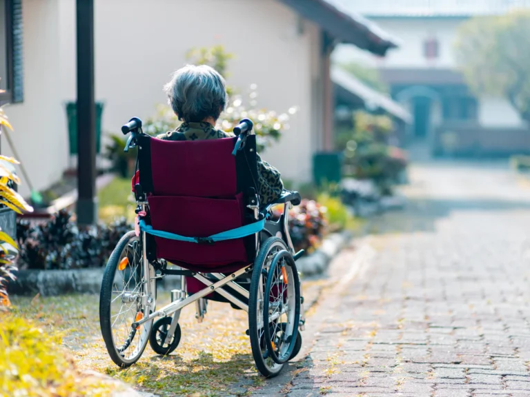 Woman sitting on wheelchair