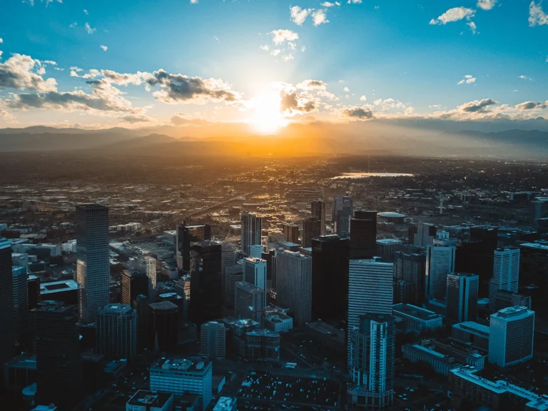 The sun is setting over a large city