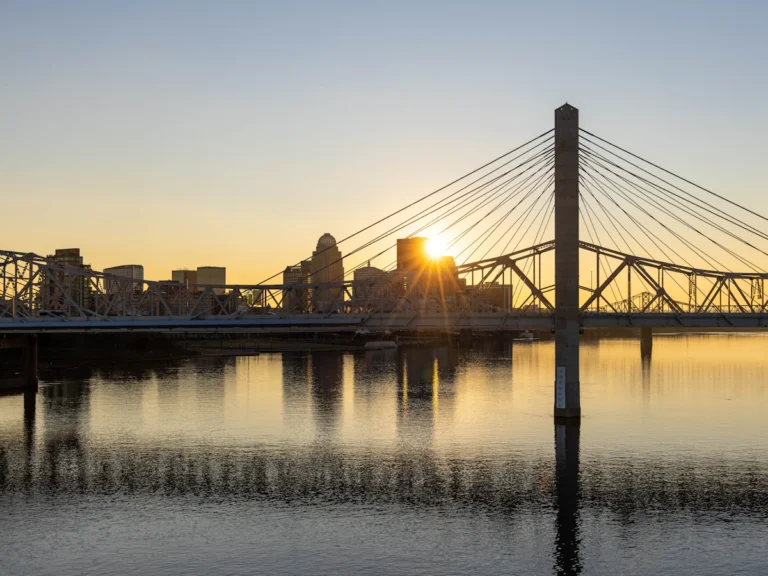 Bridge over water during sunset