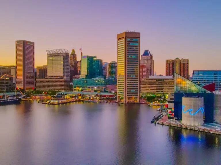City skyline across body of water during daytime