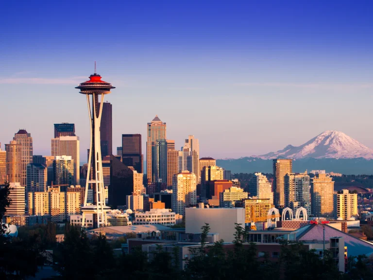 The Space Needle and Seattle skyline with Mount Rainier in the distance