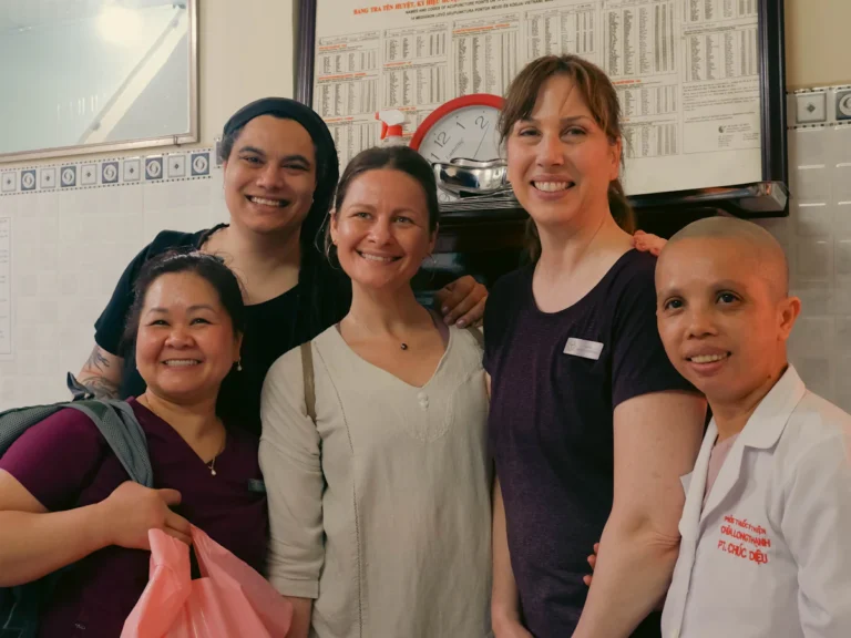 A group of people standing next to each other